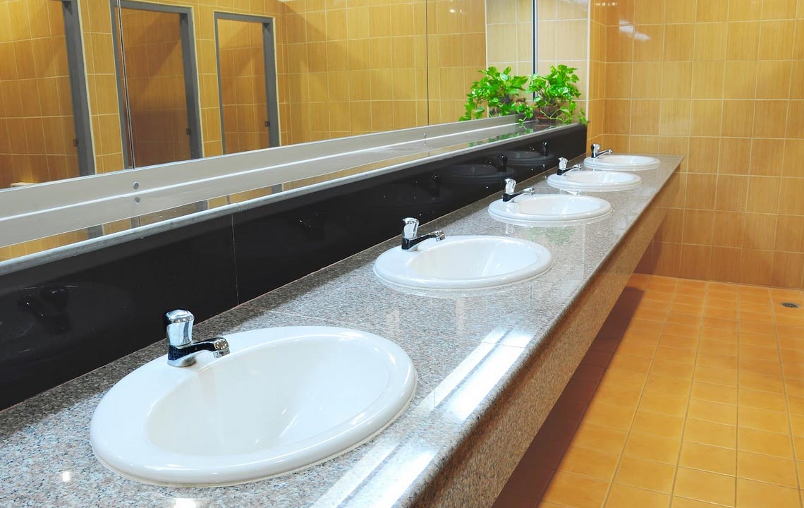 retrofitting old commercial bathrooms with modern plumbing systems