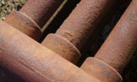 why cast iron sewer pipes corrode from the inside out