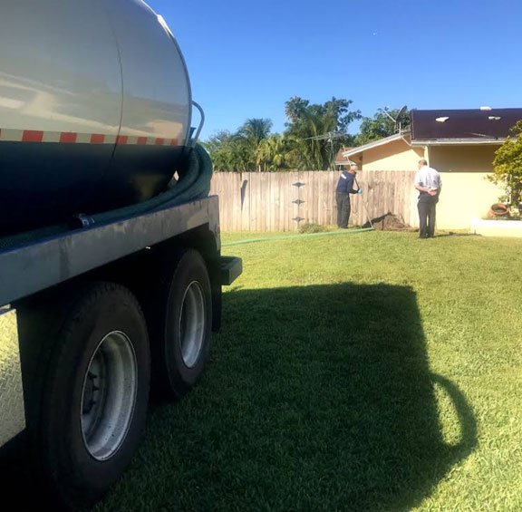our pros are working on a septic tank pumping and cleaning