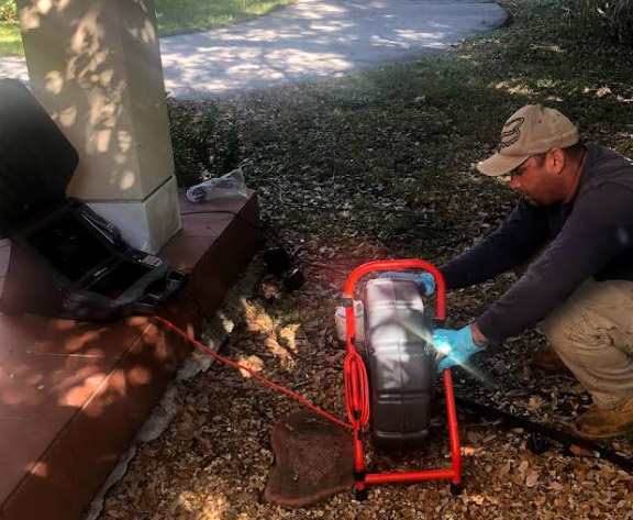 one of our dedicated plumbers is investigating a sewer issue with a sewer video camera