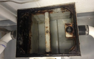 why do grease traps smell? causes, solutions, and prevention tips